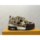 L Skate Sneaker lateral view with brown snakeskin pattern Lateral view of the L Skate Sneaker in brown snakeskin pattern