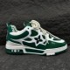 L Skate Sneaker Green White Low Top Trainers Lateral Perspective Outer side perspective showing floral cutouts on the green and white trainers