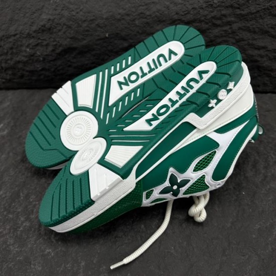 L Skate Sneaker Green White Low Top Trainers Sole View Underside view showing the tread pattern and embossed branding on the sole in green and white