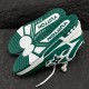 L Skate Sneaker Green White Low Top Trainers Sole View Underside view showing the tread pattern and embossed branding on the sole in green and white