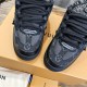 Close-up of the toe box and lace branding on black L skate shoes trainer Close-up of the toe box and lace branding on black L skate shoes trainer