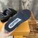 Sole view of black L skate shoes trainer showing rubber tread pattern Sole view of black L skate shoes trainer showing rubber tread pattern