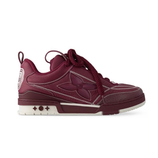 Profile view of L Skate burgundy leather low top trainers with white sole