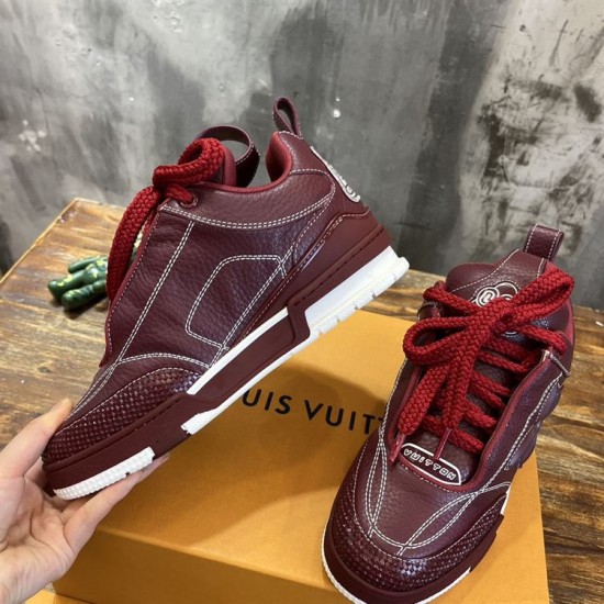 Inner side view of L Skate burgundy leather low top trainers in burgundy and white
