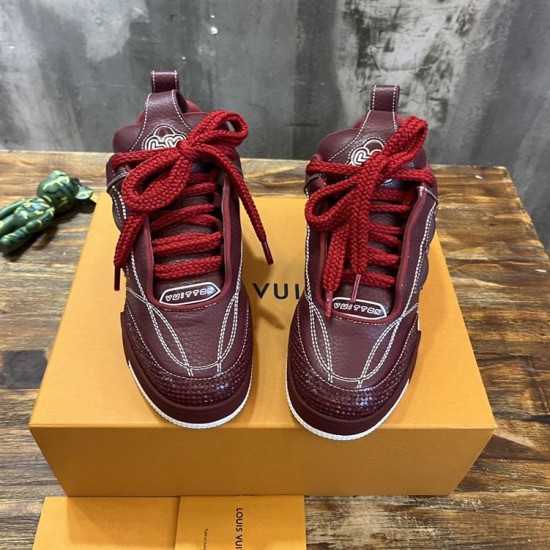 Front view of L Skate burgundy leather low top trainers showing thick laces in burgundy and white
