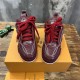 Front view of L Skate burgundy leather low top trainers showing thick laces in burgundy and white