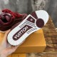 Underside view of the rubber outsole on L Skate burgundy trainers in burgundy and white