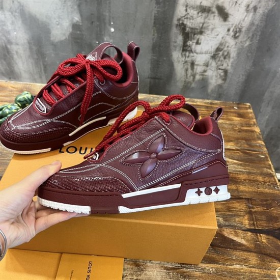 Outer side perspective of L Skate burgundy leather low top trainers in burgundy and white
