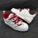 Dynamic angle shot of L Skate Leather Trainers in white and red arranged together
