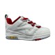 Side profile of L Skate Leather Trainers in white and red showing textured panels