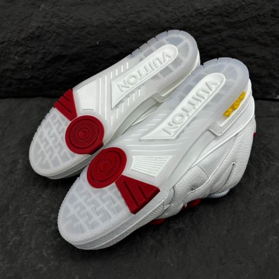 Underside sole view of L Skate Leather Trainers in white and red with grip patterns