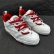 Front three-quarter perspective of L Skate Leather Trainers in white and red