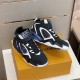 Pair Display of L Trainer High Top Black White Blue Trainers Pair of black, white and blue high-top trainers displayed together on a box