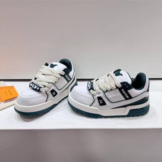 Angled view of white and green L Trainer Maxi Low Top Trainers
