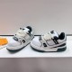 Angled view of white and green L Trainer Maxi Low Top Trainers