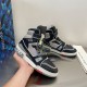 Pair of L Trainer high top leather sneakers in black and grey held together displaying profile details
