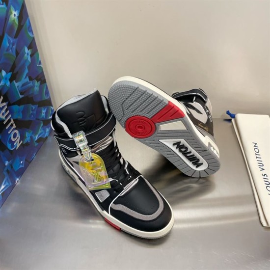 Pair of L Trainer high top leather sneakers showing rubber sole tread detail in black and grey