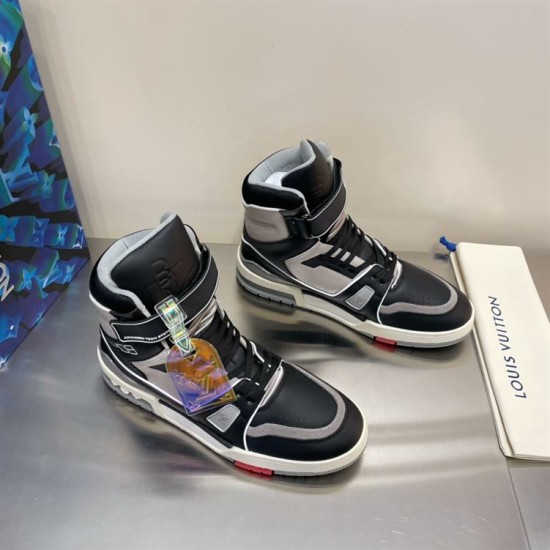 Pair of L Trainer high top leather sneakers in black and grey on surface angled view