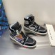 Pair of L Trainer high top leather sneakers in black and grey on surface angled view