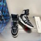 Pair of L Trainer high top leather sneakers in black and grey angled front view