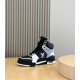 L High Top Trainer Leather Sneakers In Black And White - Outer Side View Outer side perspective of the black and white L high top trainer showing heel overlays and midsole