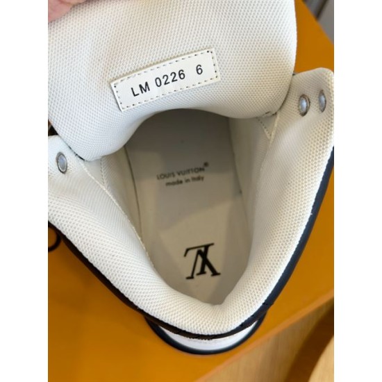 L High Top Trainer Leather Sneakers In Black And White - Interior Lining View Interior collar view of the black and white L high top trainer showing size tag and inner lining