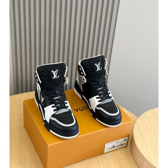 L High Top Trainer Leather Sneakers In Black And White - Front View Front high-angle view of the black and white L high top trainers showcasing the padded tongue and laces