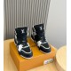 L High Top Trainer Leather Sneakers In Black And White - Front View Front high-angle view of the black and white L high top trainers showcasing the padded tongue and laces