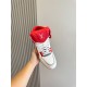 Top down view of L Trainer high top sneaker highlighting red tongue and laces in red and white