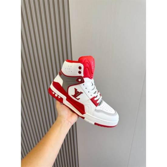 Hand holding L Trainer high top sneaker showcasing red and white leather upper