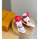 Angle view of L Trainer high top sneaker showing red collar and white laces