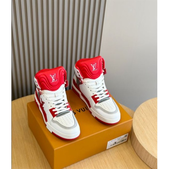 Pair of L Trainer high top sneakers in red and white placed on a presentation box