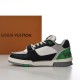 L Trainer Low Top Green Black Grey Leather Monogram Mesh Sneakers Medial View Medial side profile view of L Trainer Low Top Green Black Grey Leather Monogram Mesh Sneakers