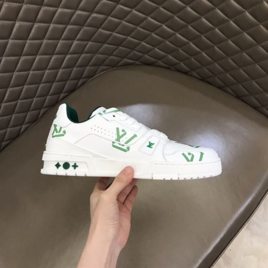 L Trainer Low Top White And Green Graphic Print Leather Sneakers inner quarter view in hand L Trainer Low Top White And Green Graphic Print Leather Sneakers inner quarter view in hand
