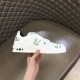 L Trainer Low Top White And Green Graphic Print Leather Sneakers inner quarter view in hand L Trainer Low Top White And Green Graphic Print Leather Sneakers inner quarter view in hand