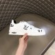 L Monogram Print Leather Low Top Trainers White Black Single Side View L Monogram Print Leather Low Top Trainers White Black single shoe side profile held