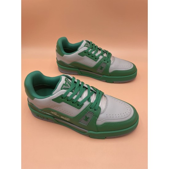 L Trainer Low Top Leather Trainers In Green And Grey - Close-up Pair Close-up angled pair view of L trainers in green and grey focusing on laces