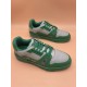 L Trainer Low Top Leather Trainers In Green And Grey - Close-up Pair Close-up angled pair view of L trainers in green and grey focusing on laces