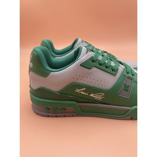 L Trainer Low Top Leather Trainers In Green And Grey - Side Detail Side detail view of L trainers in green and grey showing signature script