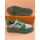 L Trainer Low Top Leather Trainers In Green And Grey - Sole and Side View Sole and side view of L trainers in green and grey showing tread pattern