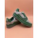 L Trainer Low Top Leather Trainers In Green And Grey - Rear Angle Rear angle view of L trainers in green and grey highlighting heel branding