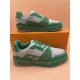 L Trainer Low Top Leather Trainers In Green And Grey - Stacked View Stacked dual view of L trainers in green and grey displaying side panel details