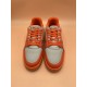 Front View of L Orange And Grey Low Top Trainer Sneakers Front view of L orange and grey low top trainer sneakers highlighting lace-up closure