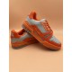 Dynamic Angle of L Orange And Grey Low Top Trainer Sneakers Dynamic angled display of L orange and grey low top trainer sneakers