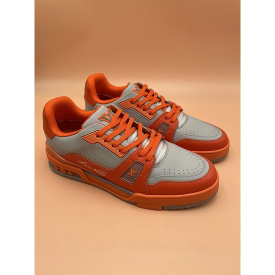Side Script Detail of L Orange And Grey Low Top Trainer Sneakers Close-up of side branding and script on L orange and grey low top trainer sneakers