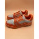 Paired View of L Orange And Grey Low Top Trainer Sneakers Angled pair arrangement of L orange and grey low top trainer sneakers