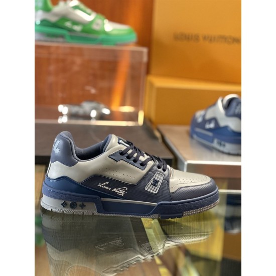 Close up side profile of L Trainer grey and navy blue leather sneakers highlighting side panels