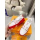 L Trainer Low Top Leather White Red Trainers Medial Side View Hand holding L Trainer Low Top Leather White Red Trainers showing inner side
