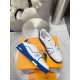 Pair of L Trainer Low Top Leather White And Blue Sneakers arranged on orange packaging
