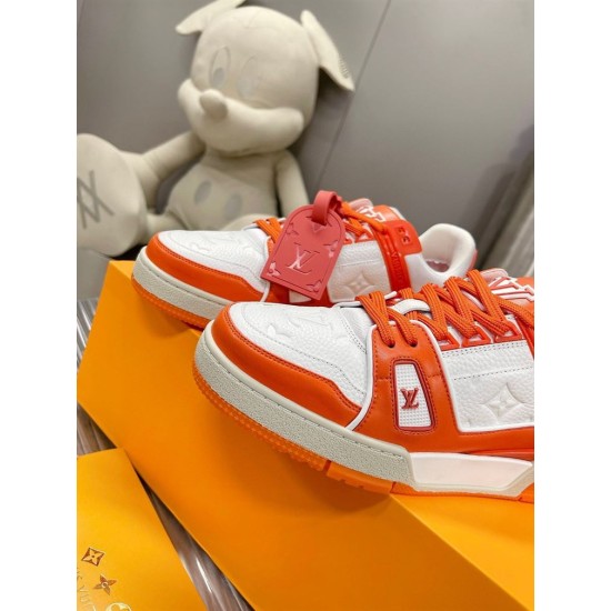 Macro detail shot of the toe box and side panels on L Trainer Low Top Orange And White Leather Sneakers